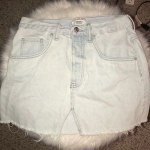 light wash jean skirt distressed hem